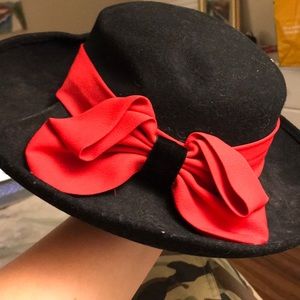 Old fashioned black hat with red ribbon